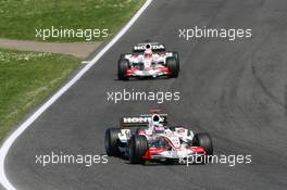 23.04.2006 Imola, Italy,  Takuma Sato (JPN), Super Aguri F1, SA05 leads Yuji Ide (JPN), Super Aguri F1, SA05 - Formula 1 World Championship, Rd 4, San Marino Grand Prix, Sunday Race