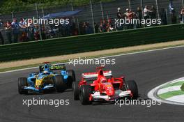 23.04.2006 Imola, Italy,  Michael Schumacher (GER), Scuderia Ferrari, 248 F1 leads Fernando Alonso (ESP), Renault F1 Team, R26 - Formula 1 World Championship, Rd 4, San Marino Grand Prix, Sunday Race