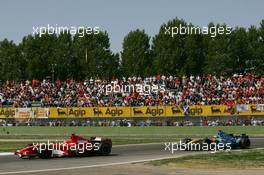 23.04.2006 Imola, Italy,  Michael Schumacher (GER), Scuderia Ferrari, 248 F1 leads Fernando Alonso (ESP), Renault F1 Team, R26 - Formula 1 World Championship, Rd 4, San Marino Grand Prix, Sunday Race