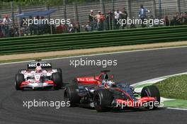 23.04.2006 Imola, Italy,  Juan-Pablo Montoya (COL), Juan Pablo, McLaren Mercedes, MP4-21 leads Yuji Ide (JPN), Super Aguri F1, SA05 - Formula 1 World Championship, Rd 4, San Marino Grand Prix, Sunday Race