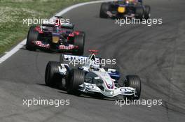 23.04.2006 Imola, Italy,  Nick Heidfeld (GER), BMW Sauber F1 Team, F1.06 leads Scott Speed (USA), Scuderia Toro Rosso, STR01 - Formula 1 World Championship, Rd 4, San Marino Grand Prix, Sunday Race