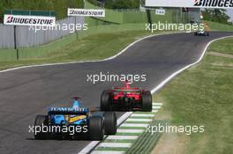 23.04.2006 Imola, Italy,  Fernando Alonso (ESP), Renault F1 Team, R26 chases Michael Schumacher (GER), Scuderia Ferrari, 248 F1 - Formula 1 World Championship, Rd 4, San Marino Grand Prix, Sunday Race