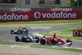 23.04.2006 Imola, Italy,  Michael Schumacher (GER), Scuderia Ferrari, 248 F1 leads Fernando Alonso (ESP), Renault F1 Team, R26 - Formula 1 World Championship, Rd 4, San Marino Grand Prix, Sunday Race