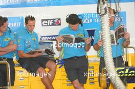 25.08.2006 Istanbul, Turkey,  Renault F1 Team members read the Red Bulletin - Formula 1 World Championship, Rd 14, Turkish Grand Prix, Friday