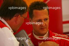 25.08.2006 Istanbul, Turkey,  Michael Schumacher (GER), Scuderia Ferrari, 248 F1 with Kees van de Grint (NED), Bridgestone Tyre Engineer - Formula 1 World Championship, Rd 14, Turkish Grand Prix, Friday Practice