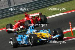 27.08.2006 Istanbul, Turkey,  Fernando Alonso (ESP), Renault F1 Team, R26 leads Michael Schumacher (GER), Scuderia Ferrari, 248 F1 - Formula 1 World Championship, Rd 14, Turkish Grand Prix, Sunday Race