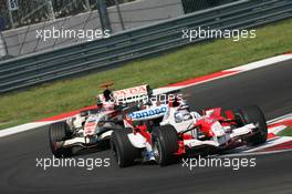 27.08.2006 Istanbul, Turkey,  Jarno Trulli (ITA), Toyota Racing, TF106 leads Rubens Barrichello (BRA), Honda Racing F1 Team, RA106  - Formula 1 World Championship, Rd 14, Turkish Grand Prix, Sunday Race