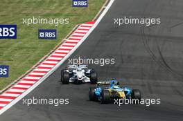 27.08.2006 Istanbul, Turkey,  Giancarlo Fisichella (ITA), Renault F1 Team, R26 and Nick Heidfeld (GER), BMW Sauber F1 Team, F1.06 - Formula 1 World Championship, Rd 14, Turkish Grand Prix, Sunday Race