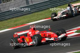 27.08.2006 Istanbul, Turkey,  Michael Schumacher (GER), Scuderia Ferrari, 248 F1 leads Jenson Button (GBR), Honda Racing F1 Team, RA106 - Formula 1 World Championship, Rd 14, Turkish Grand Prix, Sunday Race