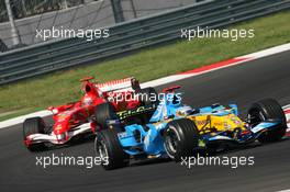 27.08.2006 Istanbul, Turkey,  Fernando Alonso (ESP), Renault F1 Team, R26 leads Michael Schumacher (GER), Scuderia Ferrari, 248 F1 - Formula 1 World Championship, Rd 14, Turkish Grand Prix, Sunday Race