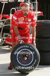 27.08.2006 Istanbul, Turkey,  A Scuderia Ferrari team member with a wheel - Formula 1 World Championship, Rd 14, Turkish Grand Prix, Sunday