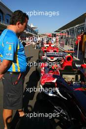 24.08.2006 Istanbul, Turkey,  A Renault F1 Team member, looks at the Scuderia Toro Rosso, STR01 - Formula 1 World Championship, Rd 14, Turkish Grand Prix, Thursday