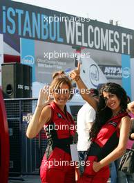 23.08.2006 Istanbul, Turkey,  Girls pose in front of an advertising banner in downtown Istanbul - Formula 1 World Championship, Rd 14, Turkish Grand Prix, Wednesday