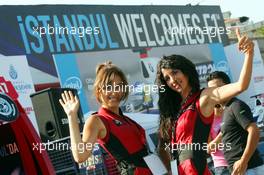 23.08.2006 Istanbul, Turkey,  Girls pose in front of an advertising banner in downtown Istanbul - Formula 1 World Championship, Rd 14, Turkish Grand Prix, Wednesday