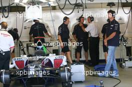 30.06.2006 Indianapolis, USA,  Mark Webber (AUS), Williams F1 Team stands in the Garage during the session - Formula 1 World Championship, Rd 10, United States Grand Prix, Friday Practice