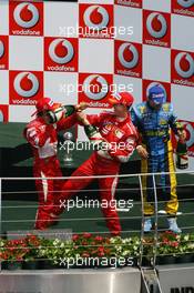 02.07.2006 Indianapolis, USA,  1st Place, Michael Schumacher (GER), Scuderia Ferrari, 248 F1, 2nd place Felipe Massa (BRA), Scuderia Ferrari, 248 F1, 3rd place Giancarlo Fisichella (ITA), Renault F1 Team, R26 - Formula 1 World Championship, Rd 10, United States Grand Prix, Sunday Podium