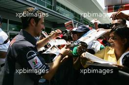 29.06.2006 Indianapolis, USA,  Tiago Monteiro (POR), Midland MF1 Racing, signs autographs for fans - Formula 1 World Championship, Rd 10, United States Grand Prix, Thursday