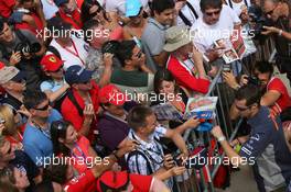 29.06.2006 Indianapolis, USA,  Tiago Monteiro (POR), Midland MF1 Racing, signs autographs for fans in the pitlane - Formula 1 World Championship, Rd 10, United States Grand Prix, Thursday