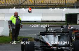 27.10.2006 Hockenheim, Germany,  Local trackmarshal watching the Formula3 cars entering the pitlane to start their practice session. - F3 Euro Series 2006 at Hockenheimring