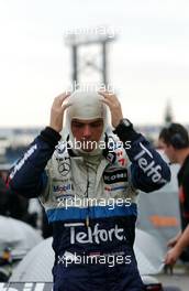 27.10.2006 Hockenheim, Germany,  Giedo van der Garde (NED), ASM Formula 3, Dallara F305 Mercedes putting on his HANS and racehelmet. In the background the distinctive clock of the Hockenheim circuit. - F3 Euro Series 2006 at Hockenheimring