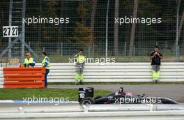 28.10.2006 Hockenheim, Germany,  Whilst Romain Grosjean (SUI), Signature-Plus, Dallara F305 Mercedes is driving by, the trackmarshals in the Spitzkehre are taking pictures and videos for their personal use in front of the safety barrier. - F3 Euro Series 2006 at Hockenheimring