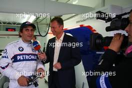 25.11.2006 Valencia, Spain, Saturday, Alessandro Zanardi (ITA), BMW Team Italy-Spain - ROAL Motorsport, WTCC, is interviewed by, DST Sports TV Channel - DELL Formula BMW World Final 2006, 23th - 26th November, Circuit de la Comunitat Valenciana Ricardo Tormo - For further information please register at www.formulabmwworldfinal-images.com - This image is free for editorial use only. Please use for Copyright/Credit: c BMW AG