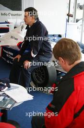 26.11.2006 Valencia, Spain, Sunday, Dr. Mario Theissen (GER), BMW Motorsport Director, talks with guests - DELL Formula BMW World Final 2006, 23th - 26th November, Circuit de la Comunitat Valenciana Ricardo Tormo - For further information please register at www.formulabmwworldfinal-images.com - This image is free for editorial use only. Please use for Copyright/Credit: c BMW AG