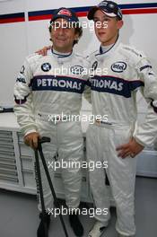 23.11.2006 Valencia, Spain, Alessandro Zanardi (ITA), BMW WTCC Driver with Marco Holzer (GER) - DELL Formula BMW World Final 2006, 23th - 26th November, Circuit de la Comunitat Valenciana Ricardo Tormo - For further information please register at www.formulabmwworldfinal-images.com - This image is free for editorial use only. Please use for Copyright/Credit: c BMW AG
