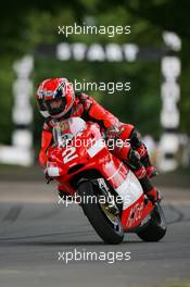 09.07.2006 Goodwood, England,  Randy Mamola (USA) takes a passenger for a ride on the Ducatti 2 seater - Goodwood Festival of Speed, Goodwood, UK