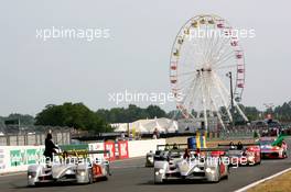 14-18.06.2006 Le Mans, France,  The two Audi's cross the line together at the end of the race, 8, AUDI SPORT TEAM JOEST (GER), LM P1, AUDI (5499T), F.BIELA (GER), E.PIRRO (ITA), M.WERNER (GER), 7, AUDI SPORT TEAM JOEST (DEU), LM P1, AUDI (5499T), R.CAPELLO (ITA), T.KRISTENSEN (DNK), A.Mc NISH (GBR) - Le Mans 24 Hours