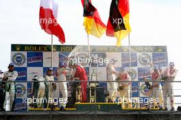 14-18.06.2006 Le Mans, France,  Celebrations on the poduim (l-r) 2nd place car 17 PESCAROLO SPORT (FRA), LM P1, PESCAROLO JUDD (4997A), E.HELARY (FRA), F.MONTAGNY (FRA), S.LOEB (FRA), 1st place car 8, AUDI SPORT TEAM JOEST (GER), LM P1, AUDI (5499T), F.BIELA (GER), E.PIRRO (ITA), M.WERNER (GER), 3rd place car 7, AUDI SPORT TEAM JOEST (DEU), LM P1, AUDI (5499T), R.CAPELLO (ITA), T.KRISTENSEN (DNK), A.Mc NISH (GBR) - Le Mans 24 Hours