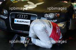 21.04.2007 Hockenheim, Germany,  Christian Abt (GER), Audi Sport Team Phoenix, Audi A4 DTM personally checking the underside of his racecar. - DTM 2007 at Hockenheimring (Deutsche Tourenwagen Masters)