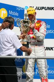 22.04.2007 Hockenheim, Germany,  Podium, Martin Tomczyk (GER), Audi Sport Team Abt Sportsline, Portrait (2nd), receiving the trophy from his father Hermann Tomczyk (GER), ADAC Sport President - DTM 2007 at Hockenheimring (Deutsche Tourenwagen Masters)