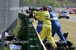 22.04.2007 Hockenheim, Germany,  Marshalls clean up the debris from the crash of Tom Kristensen (DNK), Audi Sport Team Abt Sportsline, Audi A4 DTM and Alexandre Premat (FRA), Audi Sport Team Phoenix, Audi A4 DTM - DTM 2007 at Hockenheimring (Deutsche Tourenwagen Masters)