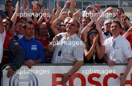 22.04.2007 Hockenheim, Germany,  Bengt Ekström (SWE), father of Audi driver Mattias Ekström was in the crowd cheering for his son and making pictures of the podium. - DTM 2007 at Hockenheimring (Deutsche Tourenwagen Masters)
