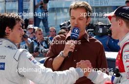 22.04.2007 Hockenheim, Germany,  (left) Bruno Spengler (CDN), Team HWA AMG Mercedes, AMG Mercedes C-Klasse congratulating (right) Mattias Ekström (SWE), Audi Sport Team Abt Sportsline, Audi A4 DTM with his vicotry during the live TV interview. - DTM 2007 at Hockenheimring (Deutsche Tourenwagen Masters)