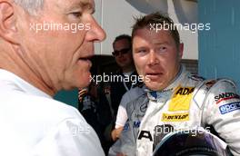 22.04.2007 Hockenheim, Germany,  (right) Mika Häkkinen (FIN), Team HWA AMG Mercedes, AMG Mercedes C-Klasse (right)  being greeted by the Mercedes physician. - DTM 2007 at Hockenheimring (Deutsche Tourenwagen Masters)