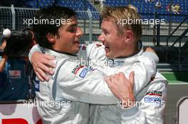 19.05.2007 Klettwitz, Germany,  Mika Häkkinen (FIN), Team HWA AMG Mercedes, Portrait (2nd, right), congratulates Bruno Spengler (CDN), Team HWA AMG Mercedes, Portrait (1st, left), with his pole position - DTM 2007 at Eurospeedway Lausitz (Lausitzring)
