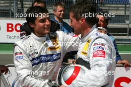 19.05.2007 Klettwitz, Germany,  Bernd Schneider (GER), Team HWA AMG Mercedes, Portrait (right), congratulates Bruno Spengler (CDN), Team HWA AMG Mercedes, Portrait (left), with his pole position - DTM 2007 at Eurospeedway Lausitz (Lausitzring)