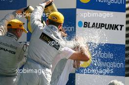 20.05.2007 Klettwitz, Germany,  Podium, Gerhard Ungar (GER), Chief Designer AMG., gets a champaign shower - DTM 2007 at Eurospeedway Lausitz (Lausitzring)