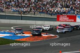 20.05.2007 Klettwitz, Germany,  Start of the race, with Mika Häkkinen (FIN), Team HWA AMG Mercedes, AMG Mercedes C-Klasse and Bruno Spengler (CDN), Team HWA AMG Mercedes, AMG Mercedes C-Klasse, breaking ultra late to keep the lead, forcing them to run wide - DTM 2007 at Eurospeedway Lausitz (Lausitzring)