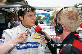 09.06.2007 Fawkham, England,  Bruno Spengler (CDN), Team HWA AMG Mercedes, Portrait, being interviewed by the local track commentator - DTM 2007 at Brands Hatch
