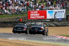 10.06.2007 Fawkham, England,  Mika Häkkinen (FIN), Team HWA AMG Mercedes, AMG Mercedes C-Klasse, overtakes Mattias Ekström (SWE), Audi Sport Team Abt Sportsline, Audi A4 DTM, on the outside of Paddock Hill bend to unlap himself. - DTM 2007 at Brands Hatch