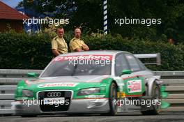 22.06.2007 Nürnberg, Germany,  Police men watching the car of Vanina Ickx (BEL), TME, Audi A4 DTM, passing by - DTM 2007 at Norisring