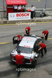 22.06.2007 Nürnberg, Germany,  Mechanics pull the car of Christian Abt (GER), Audi Sport Team Phoenix, Audi A4 DTM, back into the pits - DTM 2007 at Norisring