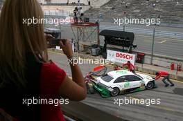 22.06.2007 Nürnberg, Germany,  A girl photohraphing the car of Adam Carroll (GBR), TME, Audi A4 DTM, in the pitlane with her mobile phone - DTM 2007 at Norisring