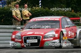 22.06.2007 Nürnberg, Germany,  Police men watching the car of Marco Werner (GER), Audi Sport Team Phoenix, Audi A4 DTM, driving by - DTM 2007 at Norisring