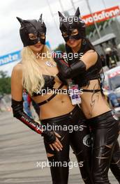 23.06.2007 Nürnberg, Germany,  Promotion girls of the Cat Racing Team in rather unconventional clothing walking through the pitlane. - DTM 2007 at Norisring