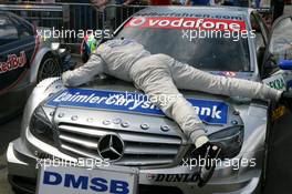 24.06.2007 Nürnberg, Germany,  Race winner Bruno Spengler (CDN), Team HWA AMG Mercedes, thanks his car for another victory - DTM 2007 at Norisring