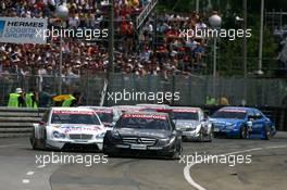 24.06.2007 Nürnberg, Germany,  Mika Häkkinen (FIN), Team HWA AMG Mercedes, AMG Mercedes C-Klasse, holding up the field very much by driving very slow as soon as the safety turns off the lights - DTM 2007 at Norisring